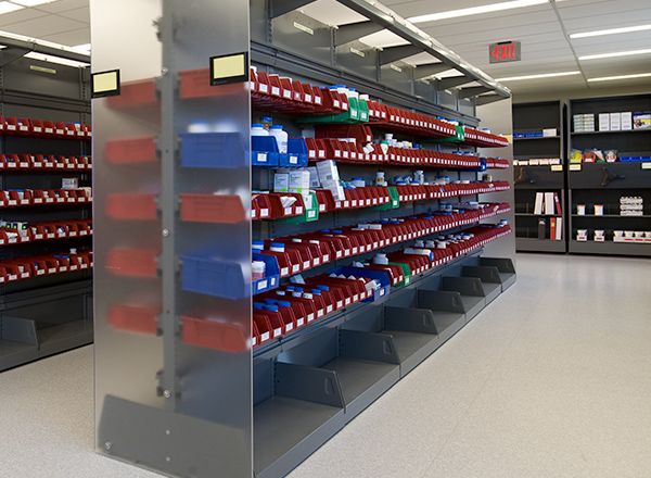 cantilever shelving with bins in a pharmacy