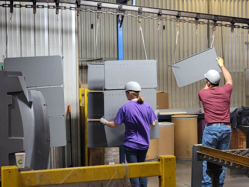 Spacesaver plant workers working on a paint line