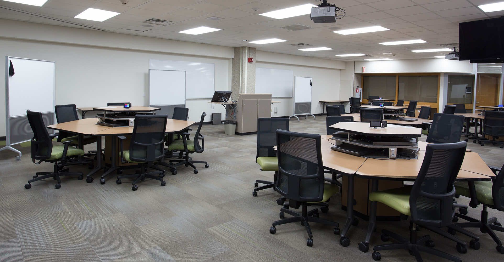 Library learning center with whiteboards, desks and chairs