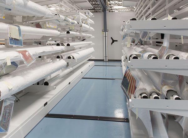 Rolled textile collection on cantilever racks