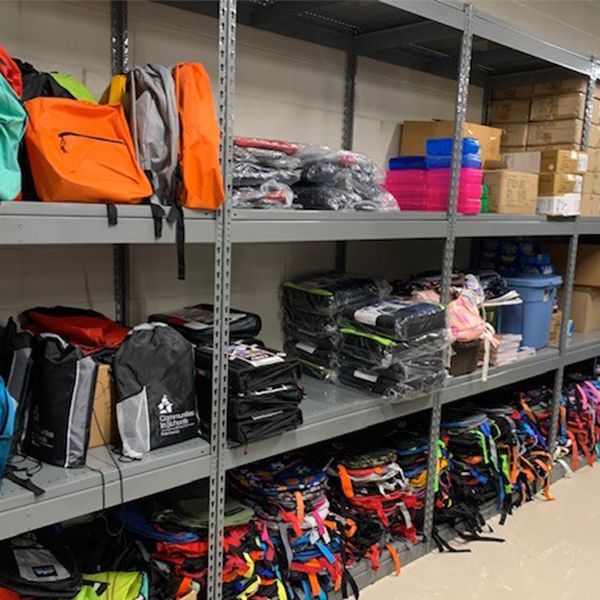 school backpacks stored on 4-post shelving