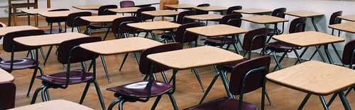 rows of desks in a school room