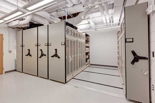 public safety weapon storage on mechanical assist high-density system