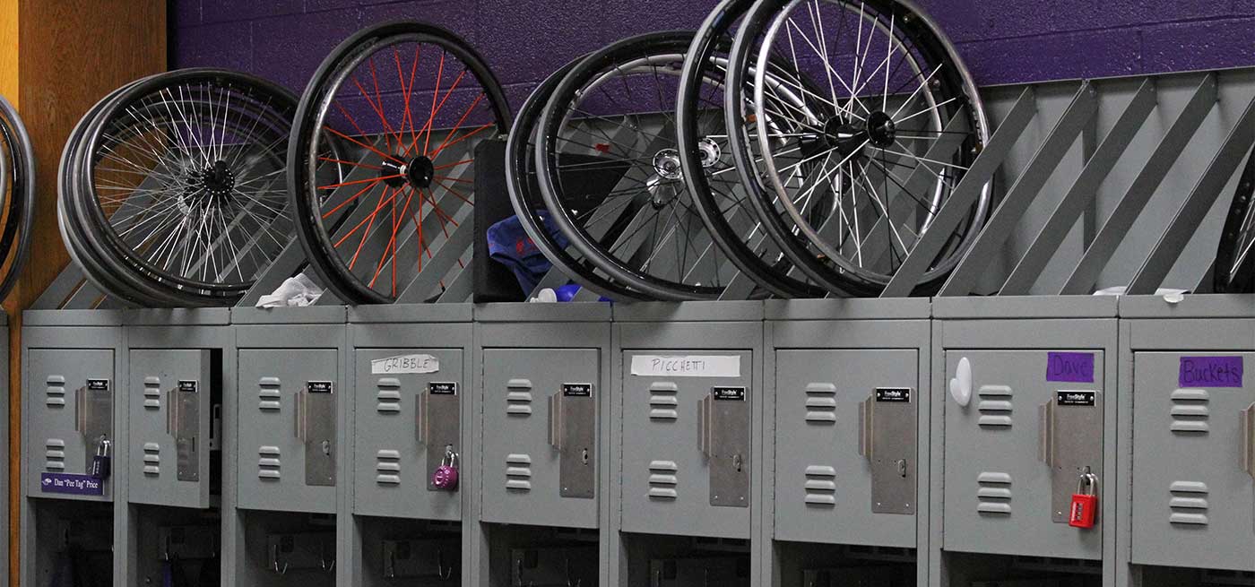 Wheelchair wheels stored on top of custom lockers for UWW's wheelchair basketball team