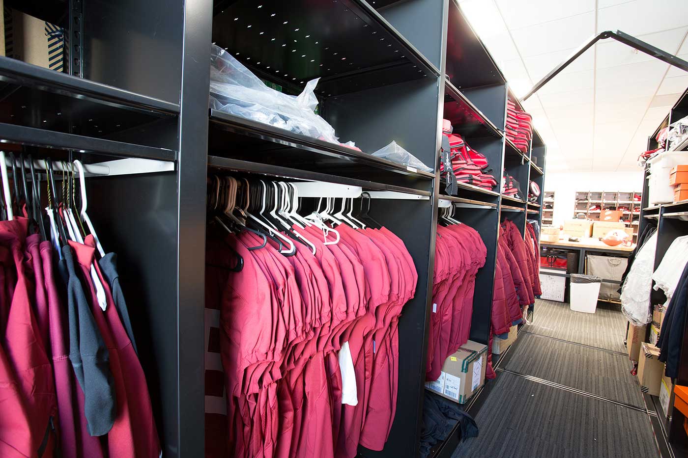 Shirts and other apparel stored on Spacesaver high-density mobile storage system