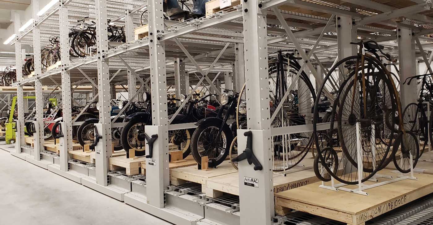 collection of bicycles being preserved on mechanical assist mobile racking system