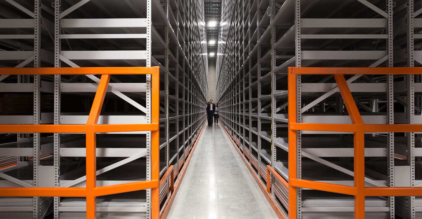 Aisle of a high-bay shelving installation at an off-site facility