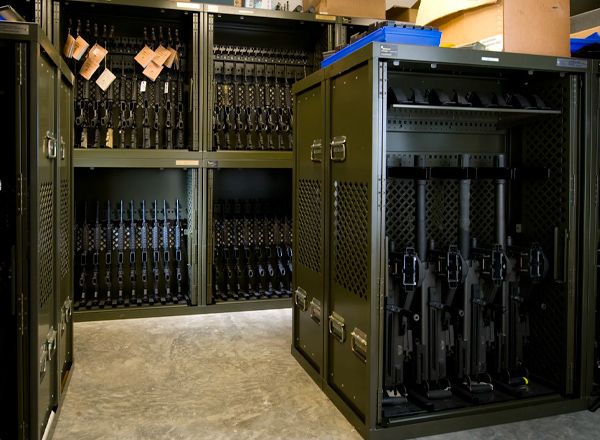Military armory with Spacesaver Universal Weapons Racks full of rifles and handguns